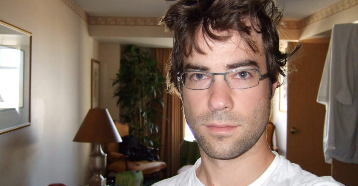 A disheveled man taking a selfie in Portland Oregon