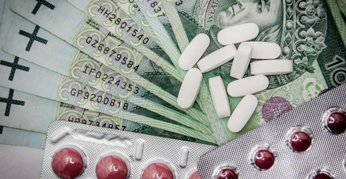 Polish 100 z oty notes with pills and blister packs illustrating medical costs
