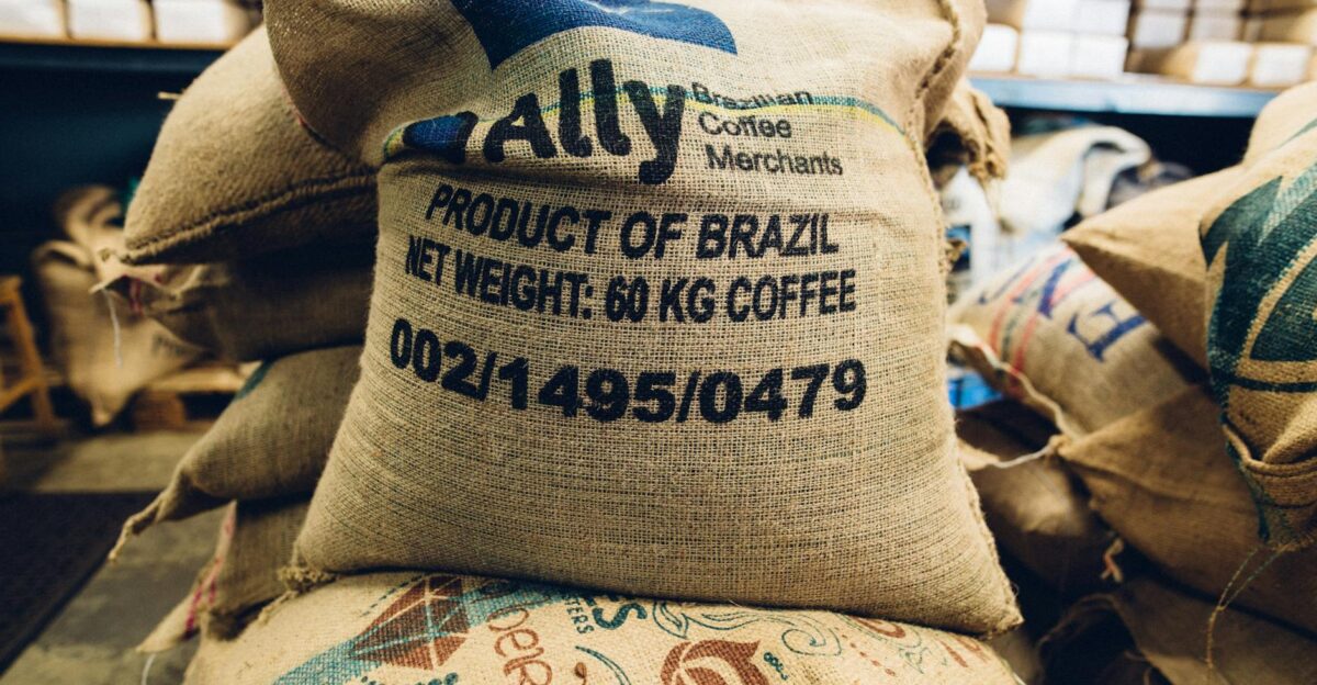 Stack of Brazilian coffee bags in a warehouse highlighting global trade and commerce