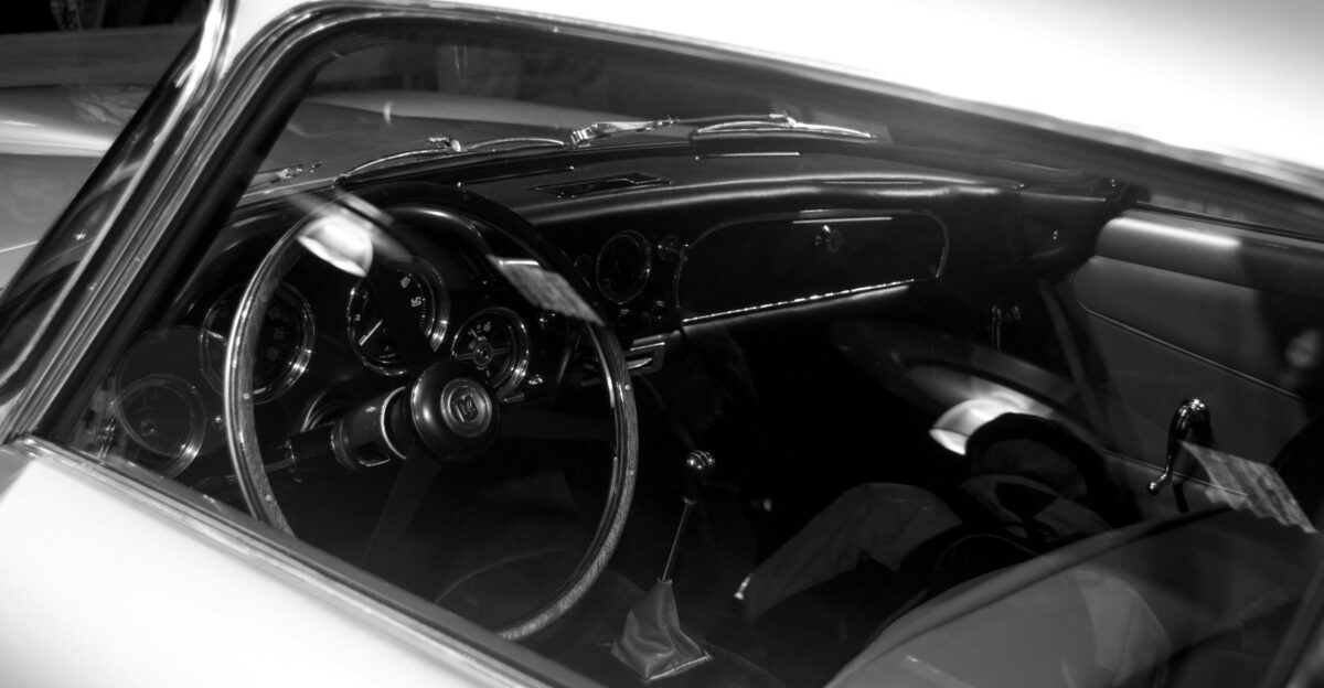 a black and white photo of a car s dashboard