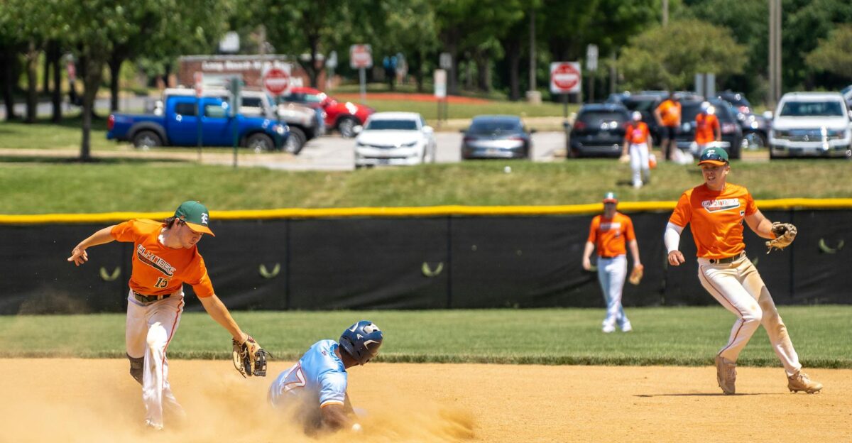 Exciting baseball game moment with athletes playing energetically on a sunny field in Columbia MD