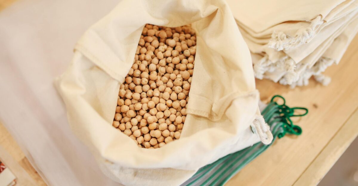 Eco-friendly shopping with reusable sacks filled with chickpeas for a zero waste lifestyle