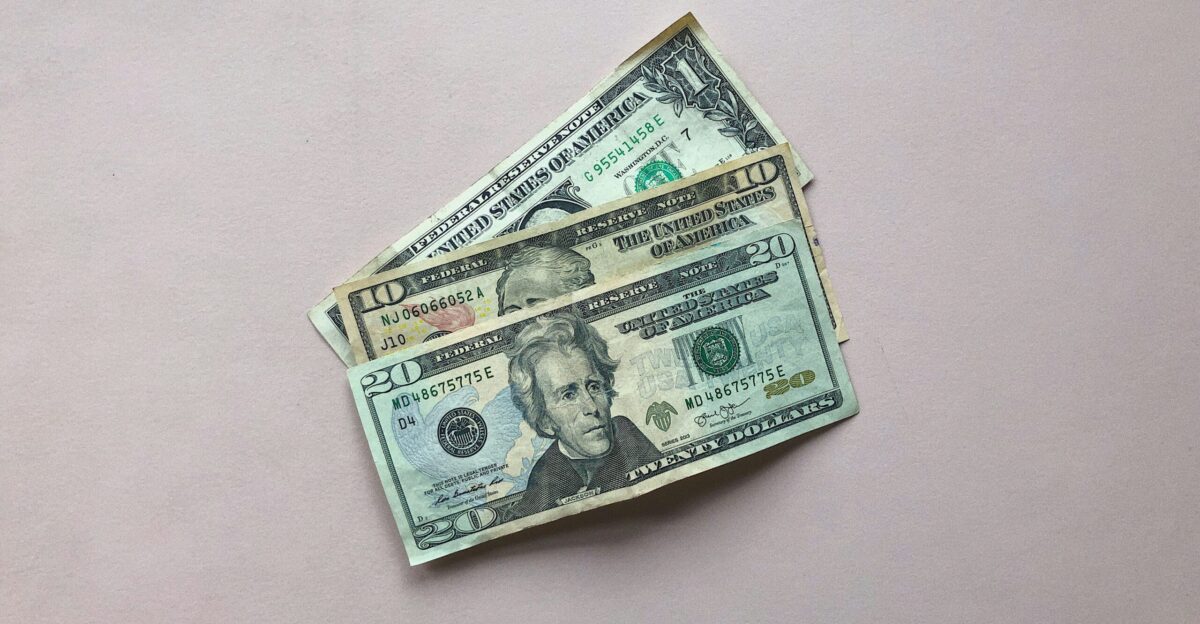 three assorted-denomination U S dollar banknotes