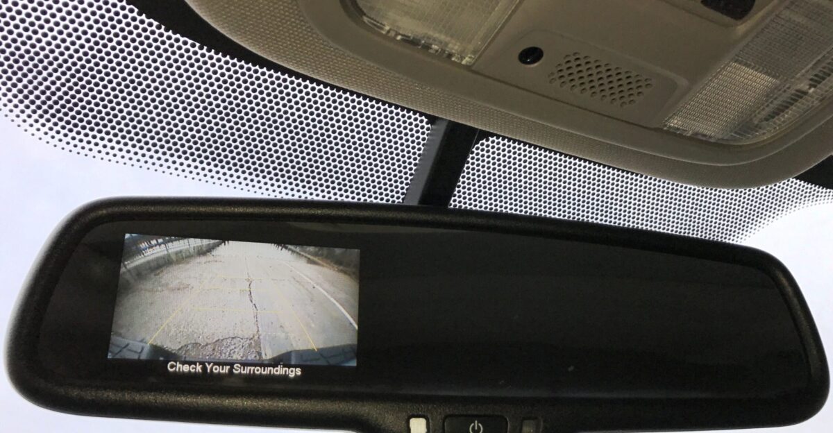 Picture of a 2014 Honda Ridgeline RTL with embedded rearview camera in the rearview mirror