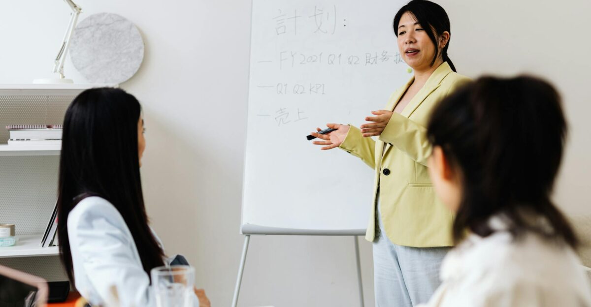 Confident businesswoman presenting strategy to colleagues in a modern office setting