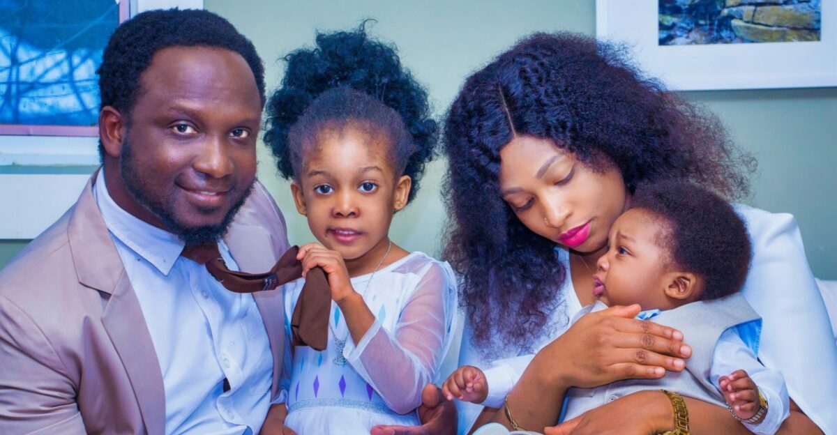 a man woman and child are posing for a picture