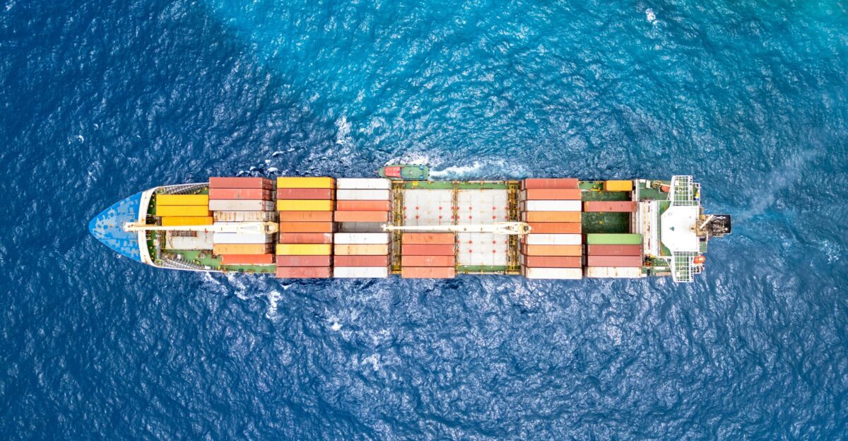 An aerial view of a cargo ship in the ocean