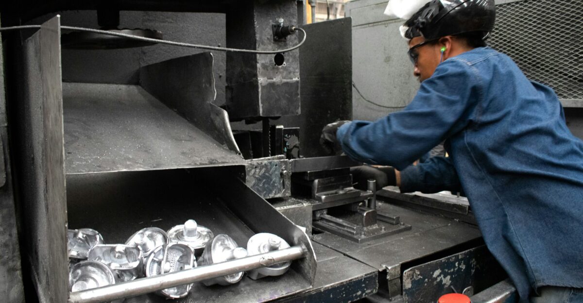 A man working on a machine in a factory
