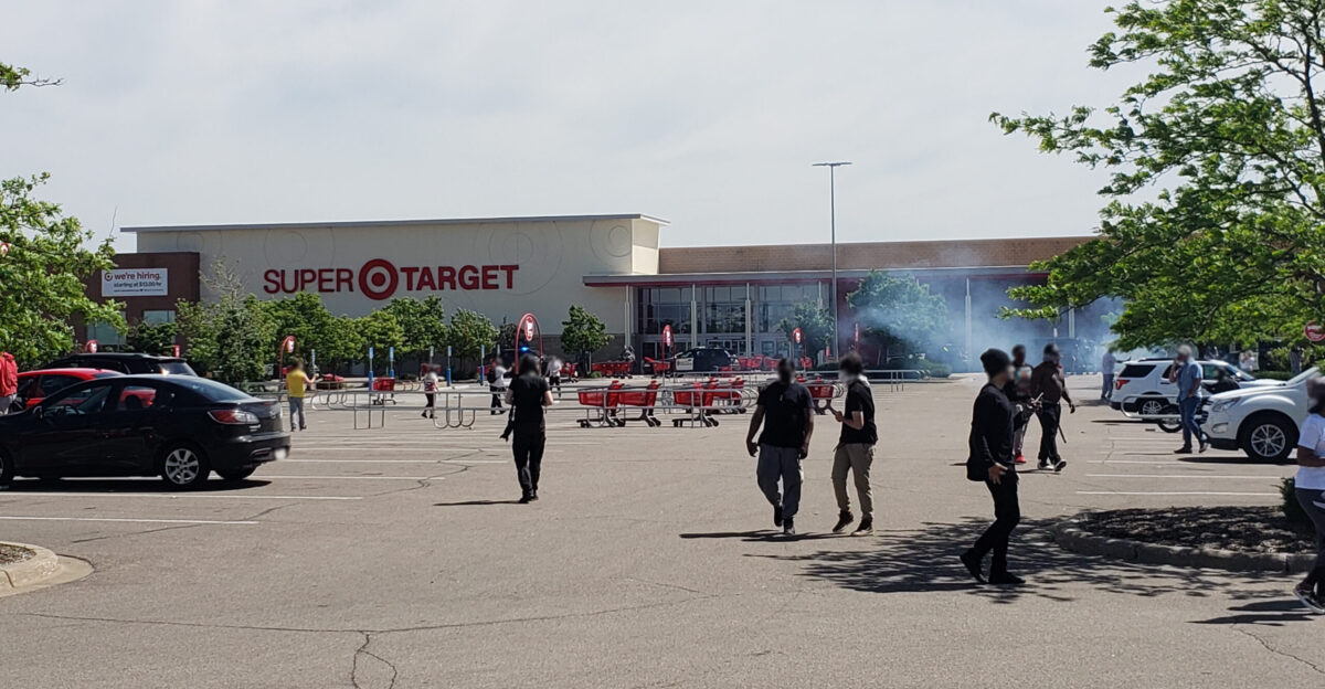 Protesters gathered outside the Super Target in the Hamline-Midway neighborhood of St Paul Minnesota on Thursday May 28th 2020 in response to the murder of George Floyd three nights prior Police arrived soon after the protesters driving off the few in the store and forming lines in front of the entrances Tear gas was fired into the crowd dispersing them from the front end of the parking lot outside the store