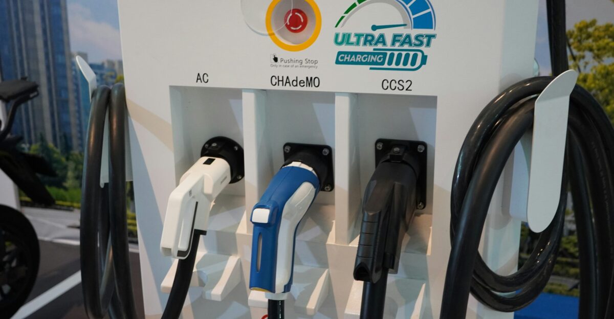 a group of gas pumps sitting next to each other