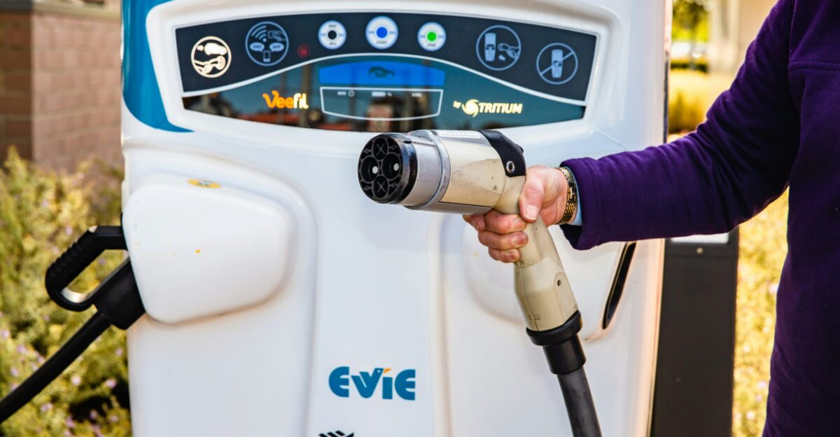 a person using a gas pump