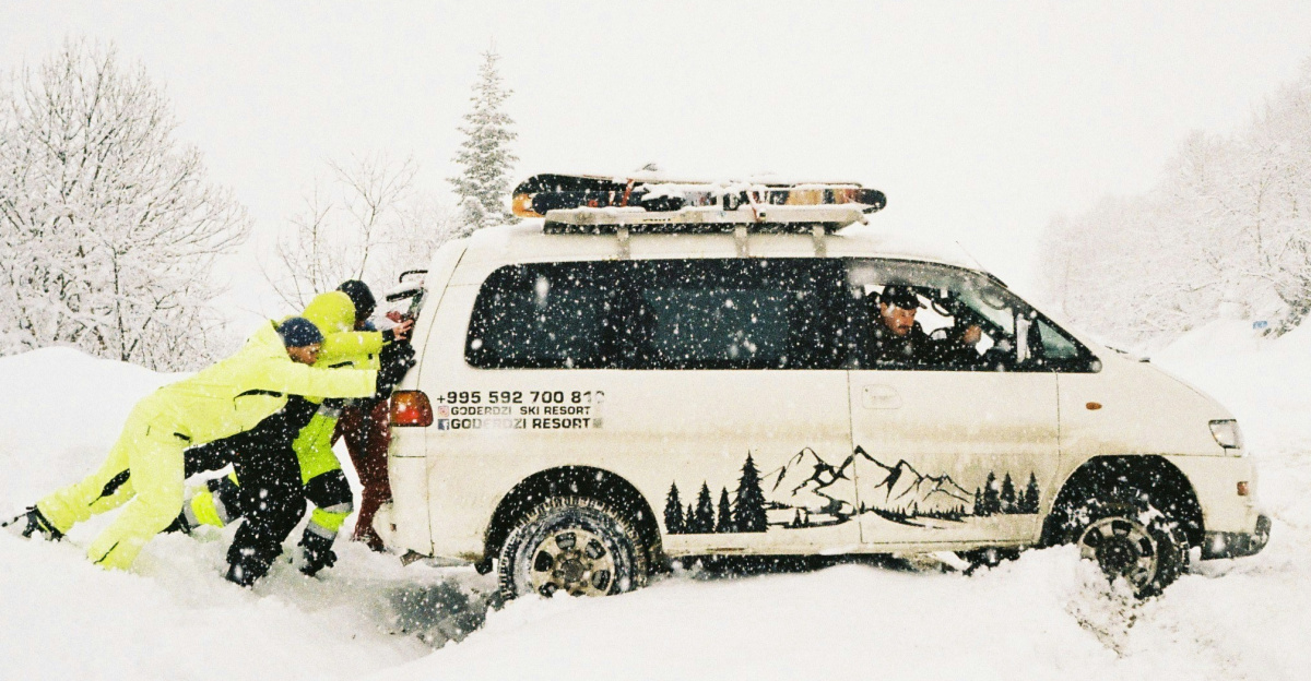 A couple of people that are standing in the snow